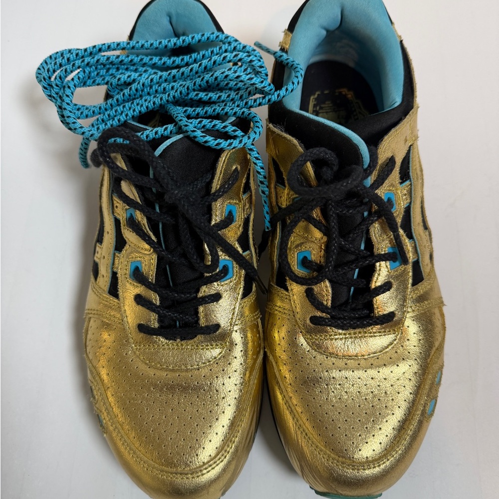 Asics Metallic Gold Athletic Sneakers with Black & Turquoise Accents